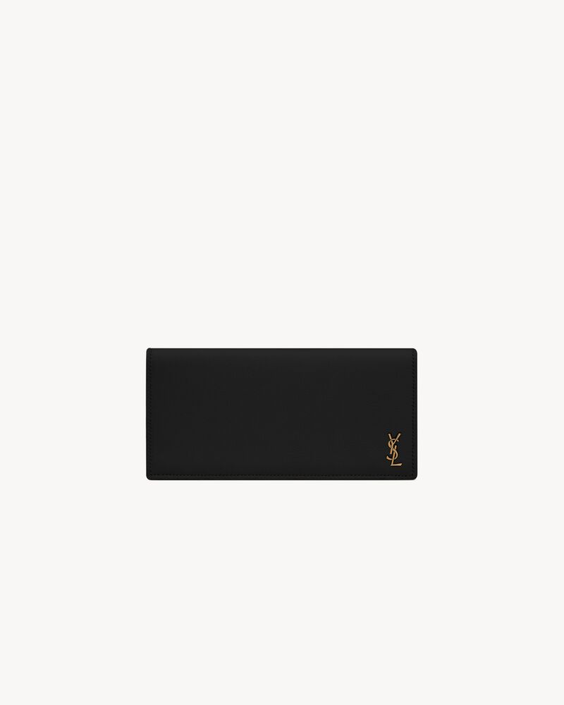 Saint Laurent TINY CASSANDRE flat wallet in grained leather